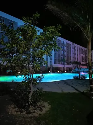a view of a building at night at Fanadir sea view Appartment in Hurghada