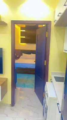 a small bedroom with a bed in a room at جوليانا بتش in Hurghada