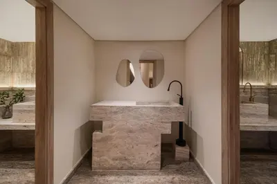 a bathroom with a stone sink and two sinks at Soleil Nile Cruise - Every Monday from Luxor for 4 & 7 Nights, and every Friday from Aswan for 3 & 7 Nights in Luxor