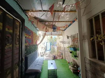 a hallway with a bench and a table in a room at Apartment Duplex Flat - Private Garden - 2 Floors in Hurghada