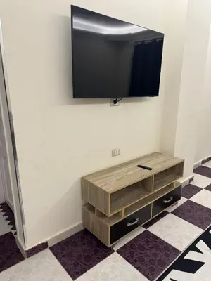 a flat screen tv hanging on a wall at Apartment all yours in Hurghada