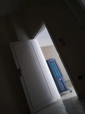 an open door of a refrigerator with a blue object at Florence el khameseny in Sahl Hasheesh