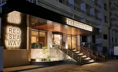 a building with a red sea way sign on it at Tiba gollden resort in Hurghada