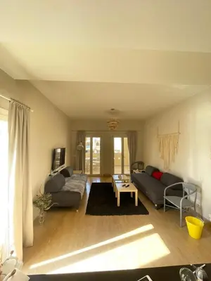 a living room with a couch and a table at Gouna Luxuy Condo Hotel in El Gouna