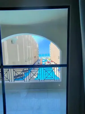 a view of the ocean from a window in a building at جوليانا سما جروب in Hurghada