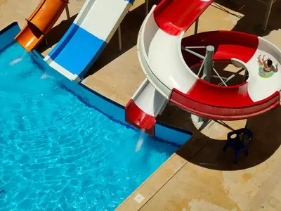 an overhead view of a water slide in a pool at جوليانا سما جروب in Hurghada