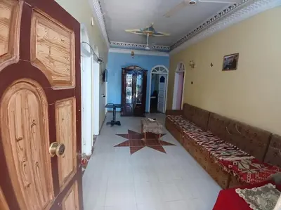 a living room with a couch and a door at Sobhy Kana House in Aswan