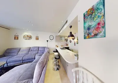 a living room with a couch and a sink at Cozy 2 Bedroom-WS3 at SCARAB Elgouna in Hurghada