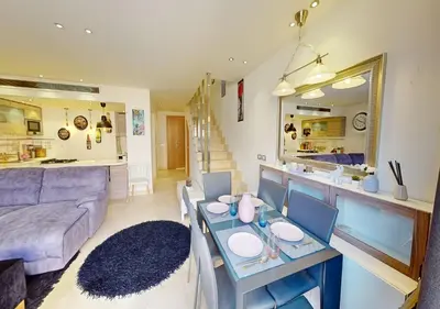 a living room with a table and a couch at Cozy 2 Bedroom-WS3 at SCARAB Elgouna in Hurghada