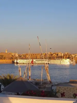 a view of a river with a boat in the water at Villa Omar El Sharif Studio n1 in Luxor