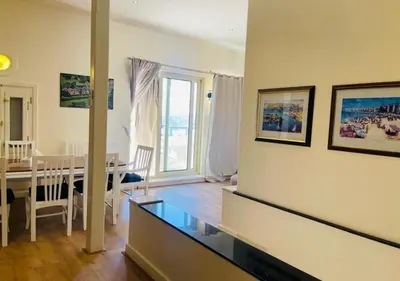 a living room with a table and a dining room at Warm Studio MB1 at Marina El Gouna in Hurghada