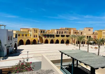 a view of a courtyard in a city with buildings at Warm Studio MB1 at Marina El Gouna in Hurghada