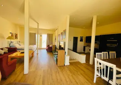 a large living room with a couch and a table at Warm Studio MB1 at Marina El Gouna in Hurghada