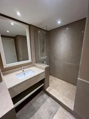 a bathroom with a sink and a mirror at Modern Apartment Abutig Marina in Hurghada
