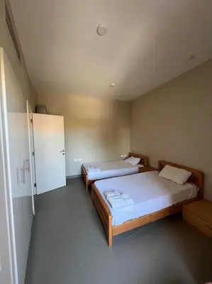 a room with two beds in a room at Modern Apartment Abutig Marina in Hurghada