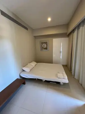 a small bedroom with a bed in a room at Modern Apartment Abutig Marina in Hurghada