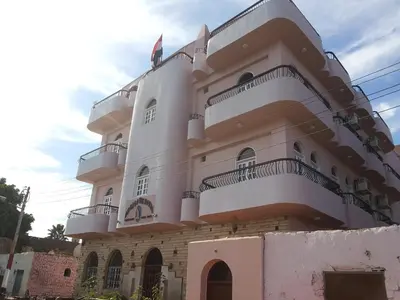 a building with balconies on the side of it at Amenophis Hotel in Luxor