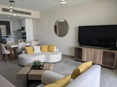 a living room with a large flat screen tv at 2BR Somabay Twin Villa in Mesca Near Beach & Pools in Hurghada