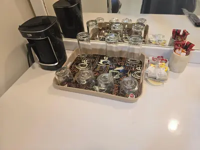 a tray of clocks sitting on top of a counter at siriuspalaceluxor in Al Karnak