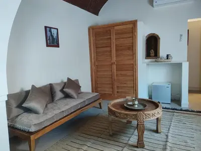 a living room with a couch and a table at Kemet House in Luxor
