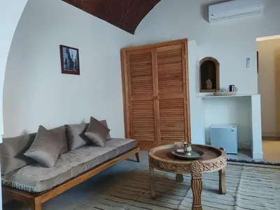 a living room with a couch and a table at Kemet House in Luxor