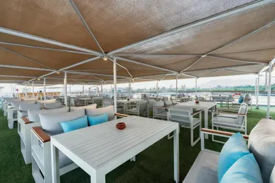 a group of tables and chairs under a tent at Orient Sun Times Nile Cruise-Every Monday from Luxor for 04 & 07 Nights - Every Friday From Aswan for 03 Nights in Luxor