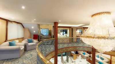 a large living room with a chandelier at Orient Sun Times Nile Cruise-Every Monday from Luxor for 04 & 07 Nights - Every Friday From Aswan for 03 Nights in Luxor