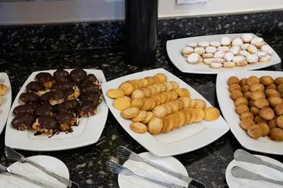 a group of plates of food on a table at Al Dora Residence Apartments in Hurghada