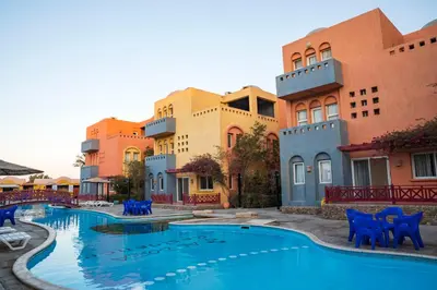 a resort with a swimming pool in front of some buildings at Al Dora Residence Apartments in Hurghada