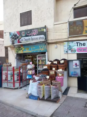 a store with a bunch of items in front of it at Rawan apartments in Luxor