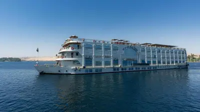 a large cruise ship sitting in the water at Orient Grand Rose Nile Cruise - Every Saturday from Luxor for 07 & 04 Nights - Every Wednesday From Aswan for 03 Nights in Luxor