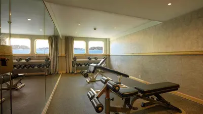 a gym with two tread machines in a room at Orient Grand Rose Nile Cruise - Every Saturday from Luxor for 07 & 04 Nights - Every Wednesday From Aswan for 03 Nights in Luxor