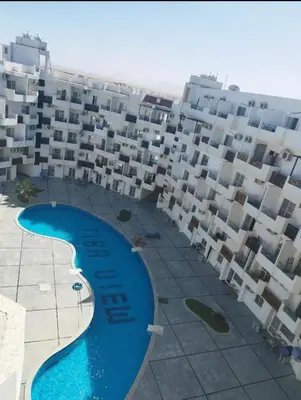 an aerial view of a large apartment building with a swimming pool at Tiba view Hurghada in El Gouna