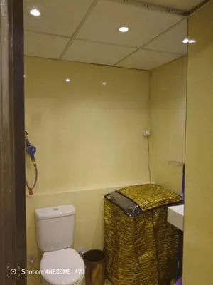a small bathroom with a toilet and a sink at الغردقة كومباوند فلورانزا خمسين in Hurghada