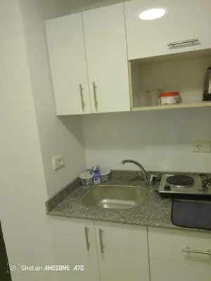 a kitchen with a sink and a counter top at الغردقة كومباوند فلورانزا خمسين in Hurghada