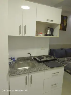a kitchen with a sink and a counter top at الغردقة كومباوند فلورانزا خمسين in Hurghada