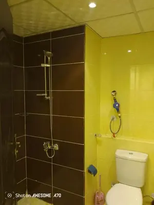 a bathroom with a shower and a toilet in it at الغردقة كومباوند فلورانزا خمسين in Hurghada