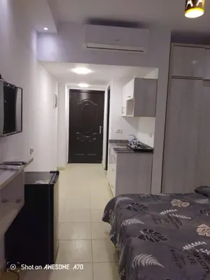 a room with a bed and a black door at الغردقة كومباوند فلورانزا خمسين in Hurghada