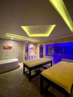 a bathroom with a bed and a tub and a table at Apartment in el karma aqua beach resort hurghada near el gouna 3 in Hurghada