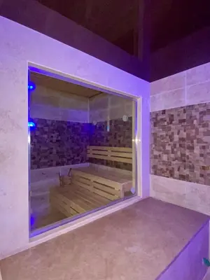 a room with a tub with purple lights in it at Apartment in el karma aqua beach resort hurghada near el gouna 3 in Hurghada