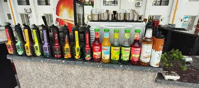 a display of bottles of drinks on a counter at Tiba Golden Resort Studio in Hurghada