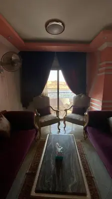 a living room with couches and a table at aswan view 3 bedrooms in Aswan