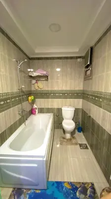 a bathroom with a tub and a toilet in it at aswan view 3 bedrooms in Aswan