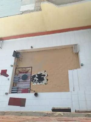 a wall that has been covered in tiles at Mourad morsy مراد in Najâ€˜ al MadÄbb