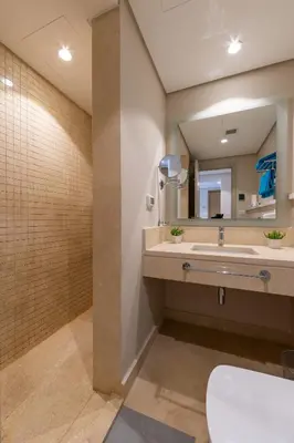 a bathroom with a sink and a large mirror at Delightful Gateway in Mangroovy in Hurghada