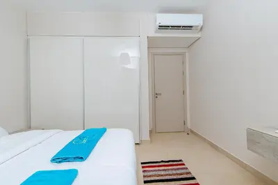 a bedroom with a bed with a blue towel on it at Delightful Gateway in Mangroovy in Hurghada