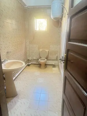 a bathroom with a toilet and a sink at SEO House in Aswan