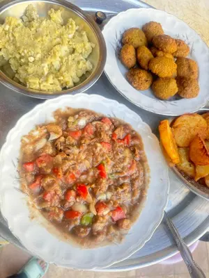 a table with three plates of food on it at SEO House in Aswan