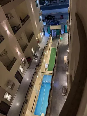 an overhead view of a pool in a building at Sea Light Apartment in Hurghada