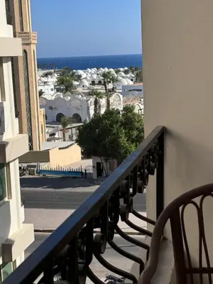 a balcony with a view of a city at Sea Light Apartment in Hurghada
